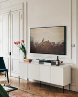Leopard and Cub by Sharon Vardy. shown as a framed stretched canvas in a living room above a console. Available as a archival giclee rolled canvas, fine art paper, or poster print. SKU 92423i.
