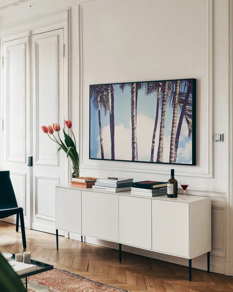 Palms by Sharon Vardy. shown as a framed stretched canvas in a living room above a console. Available as a archival giclee rolled canvas, fine art paper, or poster print. SKU 93120i.