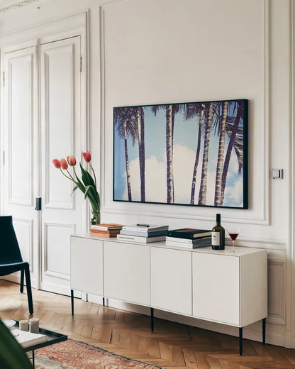 Palms by Sharon Vardy. shown as a framed stretched canvas in a living room above a console. Available as a archival giclee rolled canvas, fine art paper, or poster print. SKU 93120i.