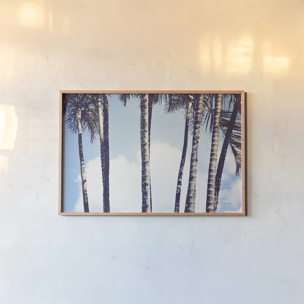 Palms by Sharon Vardy. shown as a paper print in a natural frame. Available as a archival giclee rolled canvas, fine art paper, or poster print. SKU 93120i.