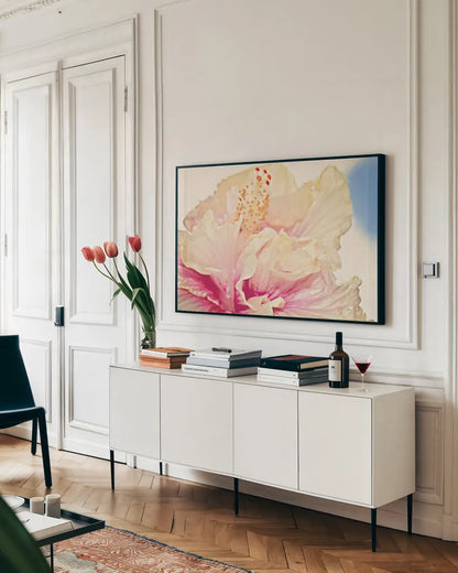 Pink Hibiscus by Sharon Vardy. shown as a framed stretched canvas in a living room above a console. Available as a archival giclee rolled canvas, fine art paper, or poster print. SKU 93128i.