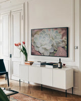 Rock Roses by Sharon Vardy. shown as a framed stretched canvas in a living room above a console. Available as a archival giclee rolled canvas, fine art paper, or poster print. SKU 93130i.