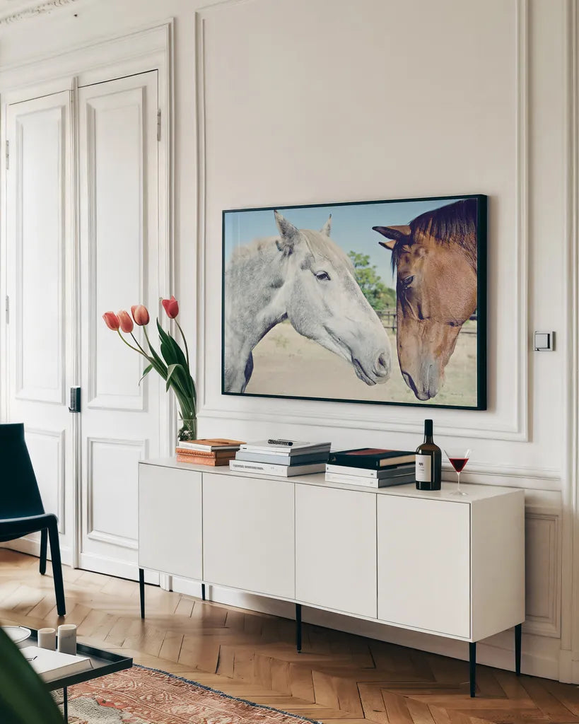 Two Horses by Sharon Vardy. shown as a framed stretched canvas in a living room above a console. Available as a archival giclee rolled canvas, fine art paper, or poster print. SKU 92184i.