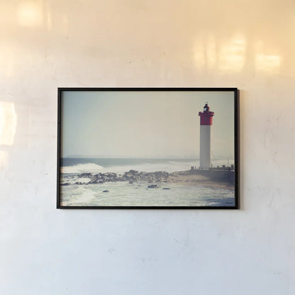 Umhlanga Lighthouse by Sharon Vardy. shown as a paper print in a black flame. Available as a archival giclee rolled canvas, fine art paper, or poster print. SKU 93121i.