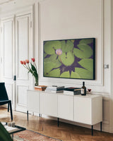 Water Lilies by Sharon Vardy. shown as a framed stretched canvas in a living room above a console. Available as a archival giclee rolled canvas, fine art paper, or poster print. SKU 93131i.
