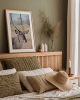 Waterbuck Portrait by Sharon Vardy. shown as a paper print in a natural frame. Available as a archival giclee rolled canvas, fine art paper, or poster print. SKU 92219h.
