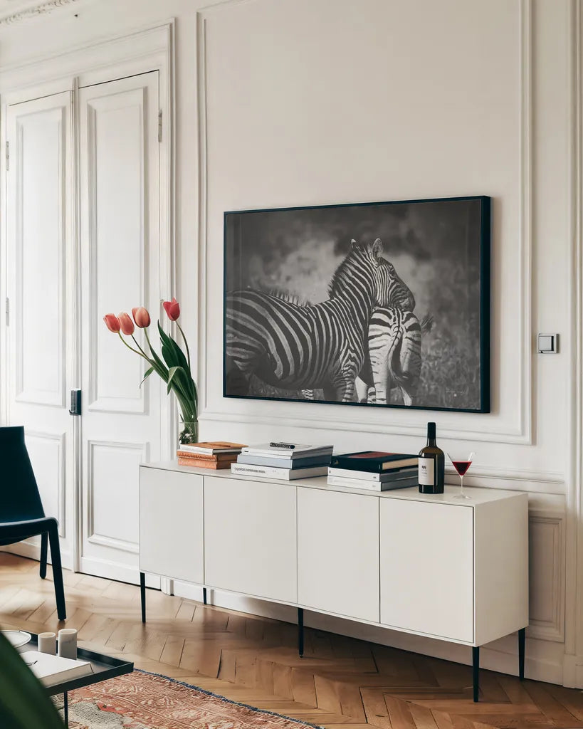 Zebra Love by Sharon Vardy. shown as a framed stretched canvas in a living room above a console. Available as a archival giclee rolled canvas, fine art paper, or poster print. SKU 93133i.