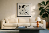 Abstract Garden I by Shirley Novak. Displayed in a glass frame with matte in a clean modern living room. Available as an archival giclee rolled canvas, fine art paper, or poster print. SKU 89177a.
