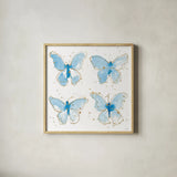 Gilded Butterflies by Shirley Novak. Shown in a natural wood glass frame for a timeless modern aesthetic. Available as an archival giclee rolled canvas, fine art paper, or poster print. SKU 29794a.