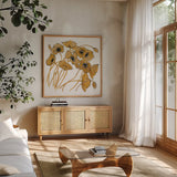 Gold Black Line Poppies II by Shirley Novak. Shown in a natural wood frame in a cozy modern living room. Available as an archival giclee rolled canvas, fine art paper, or poster print. SKU 31255a.
