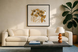 Gold Black Line Poppies II by Shirley Novak. Displayed in a glass frame with matte in a clean modern living room. Available as an archival giclee rolled canvas, fine art paper, or poster print. SKU 31255a.