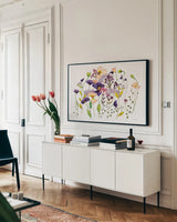 Pink and Purple Poppies by Shirley Novak. shown as a framed stretched canvas in a living room above a console. Available as a archival giclee rolled canvas, fine art paper, or poster print. SKU 89483i.