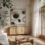 Planetary I by Shirley Novak. Shown in a natural wood frame in a cozy modern living room. Available as an archival giclee rolled canvas, fine art paper, or poster print. SKU 22917a.