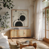 Planetary III by Shirley Novak. Shown in a natural wood frame in a cozy modern living room. Available as an archival giclee rolled canvas, fine art paper, or poster print. SKU 22919a.