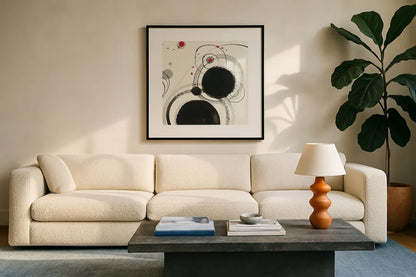 Planetary III with Red by Shirley Novak. Displayed in a glass frame with matte in a clean modern living room. Available as an archival giclee rolled canvas, fine art paper, or poster print. SKU 30935a.