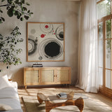 Planetary IV with Red by Shirley Novak. Shown in a natural wood frame in a cozy modern living room. Available as an archival giclee rolled canvas, fine art paper, or poster print. SKU 30936a.