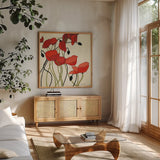 Poppies and Cream I by Shirley Novak. Shown in a natural wood frame in a cozy modern living room. Available as an archival giclee rolled canvas, fine art paper, or poster print. SKU 4669a.