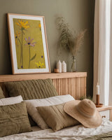 Rudbeckia Float by Shirley Novak. shown as a paper print in a natural frame. Available as a archival giclee rolled canvas, fine art paper, or poster print. SKU 98500h.