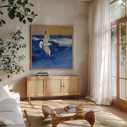 Seagulls with Gold Sky II by Shirley Novak. Shown in a natural wood frame in a cozy modern living room. Available as an archival giclee rolled canvas, fine art paper, or poster print. SKU 25257a.