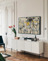 Snow Day Gray Flower by Shirley Novak. shown as a framed stretched canvas in a living room above a console. Available as a archival giclee rolled canvas, fine art paper, or poster print. SKU 23719i.