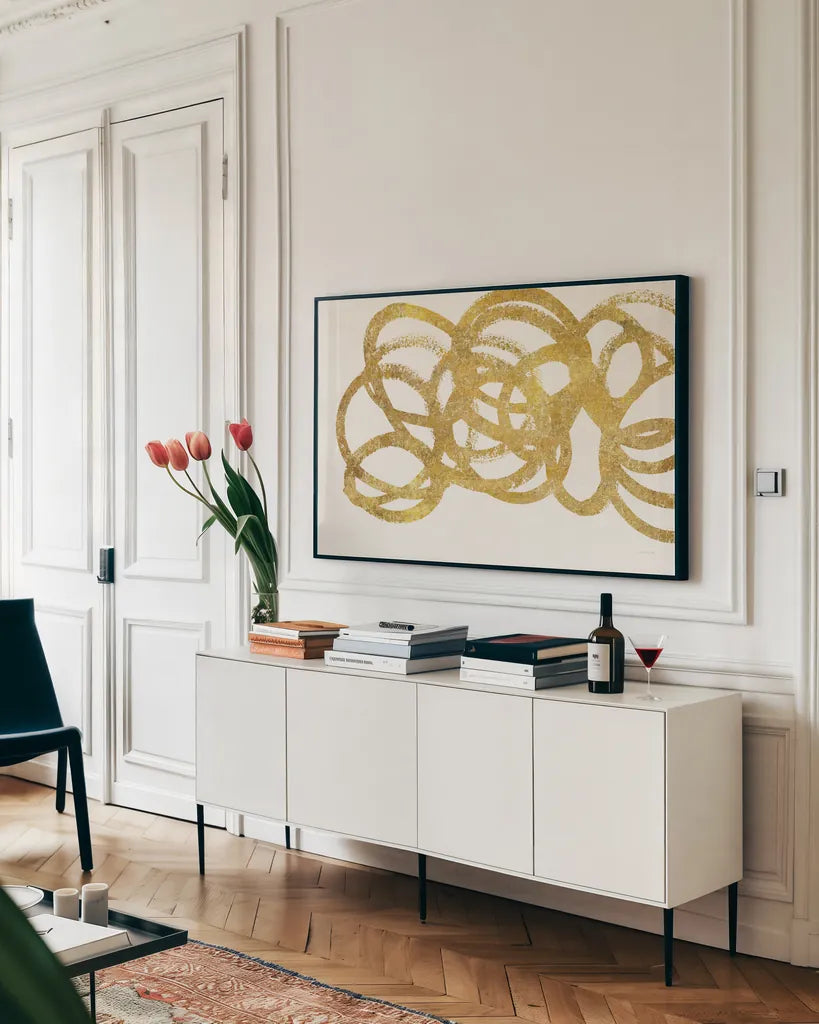 Swirling Element I Crop I Gold by Shirley Novak. shown as a framed stretched canvas in a living room above a console. Available as a archival giclee rolled canvas, fine art paper, or poster print. SKU 68389i.