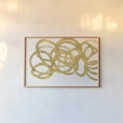 Swirling Element I Crop I Gold by Shirley Novak. shown as a paper print in a natural frame. Available as a archival giclee rolled canvas, fine art paper, or poster print. SKU 68389i.