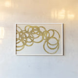 Swirling Element I Crop II Gold by Shirley Novak. shown as a paper print in a white frame. Available as a archival giclee rolled canvas, fine art paper, or poster print. SKU 68390i.