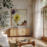 White Poppies Up Close by Shirley Novak. Shown in a natural wood frame in a cozy modern living room. Available as an archival giclee rolled canvas, fine art paper, or poster print. SKU 90696a.
