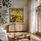 Yellow Action August by Shirley Novak. Shown in a natural wood frame in a cozy modern living room. Available as an archival giclee rolled canvas, fine art paper, or poster print. SKU 91263a.