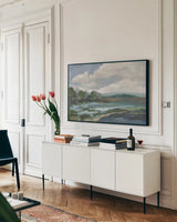  Light Blue Coastal Flowers by Silvia Vassileva. shown as a framed stretched canvas in a living room above a console. Available as a archival giclee rolled canvas, fine art paper, or poster print. SKU 85815i.