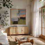Abstract Fragments I by Silvia Vassileva. Shown in a natural wood frame in a cozy modern living room. Available as an archival giclee rolled canvas, fine art paper, or poster print. SKU 92004a.