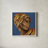 African Beauty I Blue by Silvia Vassileva. Shown in a crisp white glass frame for a clean and minimalist style. Available as an archival giclee rolled canvas, fine art paper, or poster print. SKU 72626a.