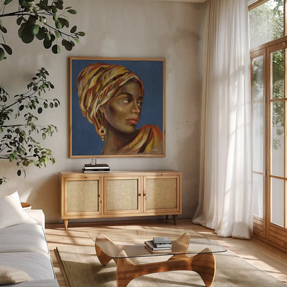 African Beauty I Blue by Silvia Vassileva. Shown in a natural wood frame in a cozy modern living room. Available as an archival giclee rolled canvas, fine art paper, or poster print. SKU 72626a.