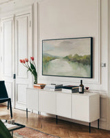 April River Light by Silvia Vassileva. shown as a framed stretched canvas in a living room above a console. Available as a archival giclee rolled canvas, fine art paper, or poster print. SKU 77382i.