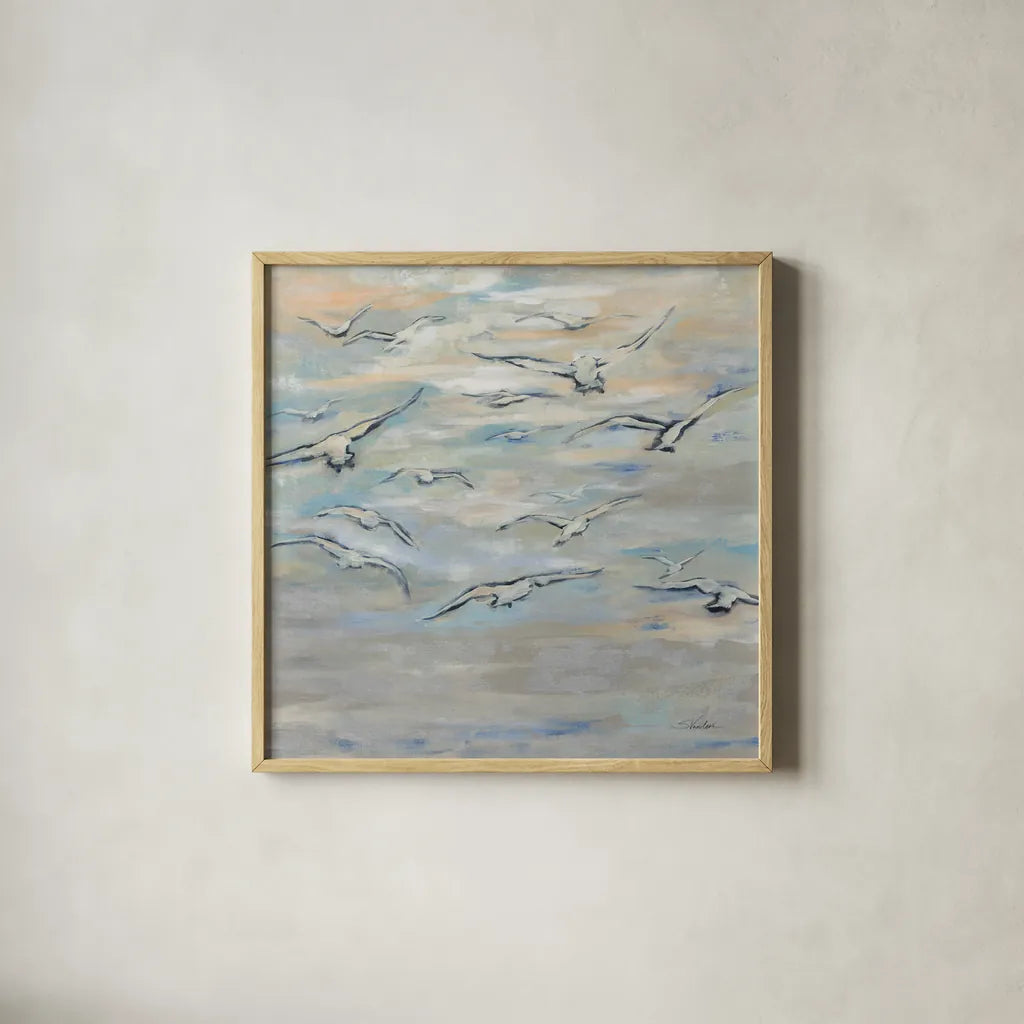 Birds and Wispy Clouds by Silvia Vassileva. Shown in a natural wood glass frame for a timeless modern aesthetic. Available as an archival giclee rolled canvas, fine art paper, or poster print. SKU 100774a.