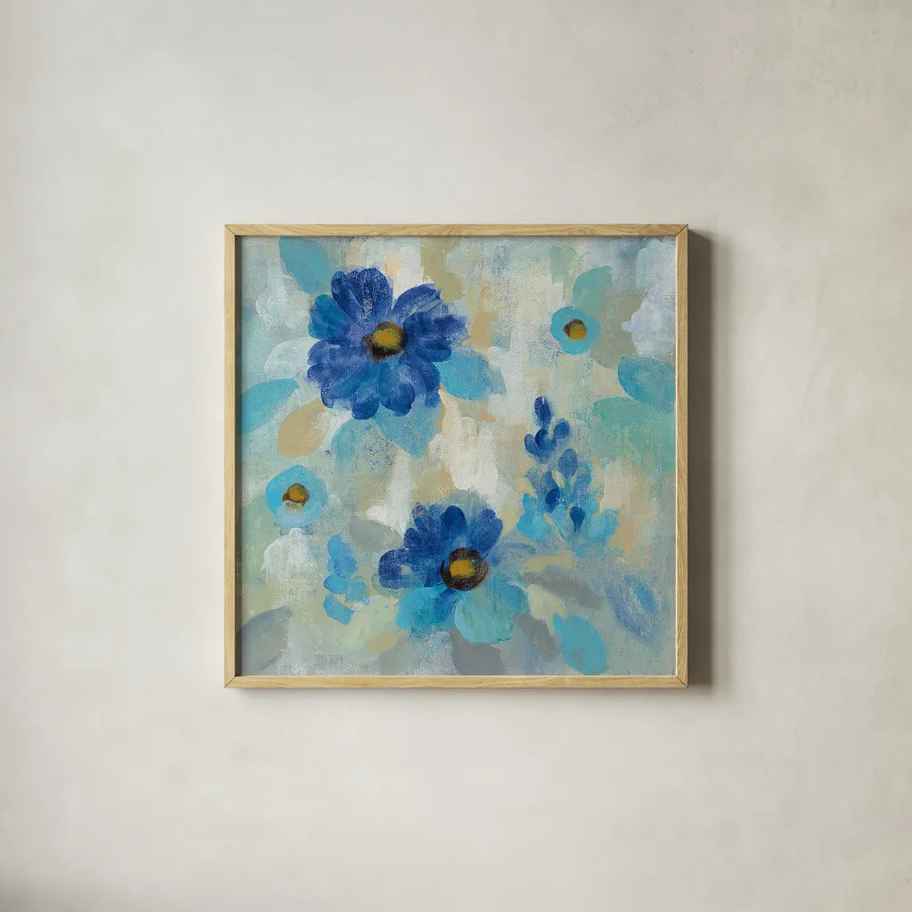 Blue Flowers Whisper II by Silvia Vassileva. Shown in a natural wood glass frame for a timeless modern aesthetic. Available as an archival giclee rolled canvas, fine art paper, or poster print. SKU 28658a.