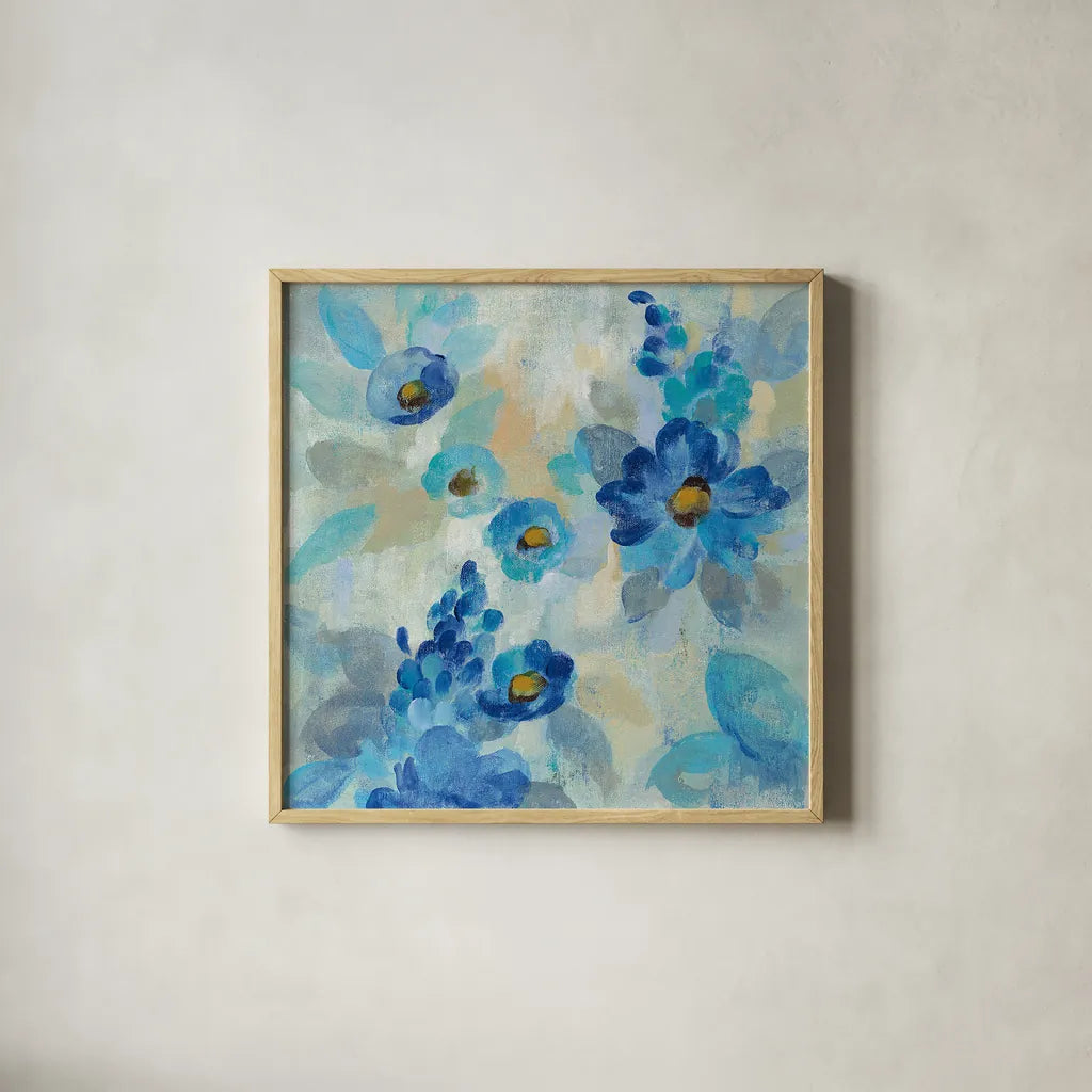 Blue Flowers Whisper III by Silvia Vassileva. Shown in a natural wood glass frame for a timeless modern aesthetic. Available as an archival giclee rolled canvas, fine art paper, or poster print. SKU 28659a.