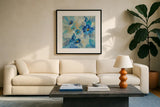 Blue Flowers Whisper III by Silvia Vassileva. Displayed in a glass frame with matte in a clean modern living room. Available as an archival giclee rolled canvas, fine art paper, or poster print. SKU 28659a.