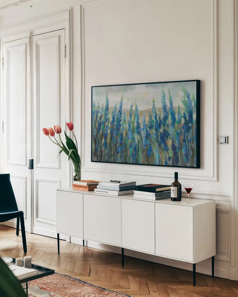 Blue Meadow by Silvia Vassileva. shown as a framed stretched canvas in a living room above a console. Available as a archival giclee rolled canvas, fine art paper, or poster print. SKU 98567i.
