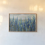 Blue Meadow by Silvia Vassileva. shown as a paper print in a natural frame. Available as a archival giclee rolled canvas, fine art paper, or poster print. SKU 98567i.