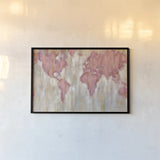 Blush World Map by Silvia Vassileva. shown as a paper print in a black flame. Available as a archival giclee rolled canvas, fine art paper, or poster print. SKU 38248i.