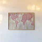 Blush World Map by Silvia Vassileva. shown as a paper print in a natural frame. Available as a archival giclee rolled canvas, fine art paper, or poster print. SKU 38248i.