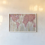 Blush World Map by Silvia Vassileva. shown as a paper print in a white frame. Available as a archival giclee rolled canvas, fine art paper, or poster print. SKU 38248i.
