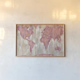 Blushing World Map v2 Crop by Silvia Vassileva. shown as a paper print in a natural frame. Available as a archival giclee rolled canvas, fine art paper, or poster print. SKU 38551i.