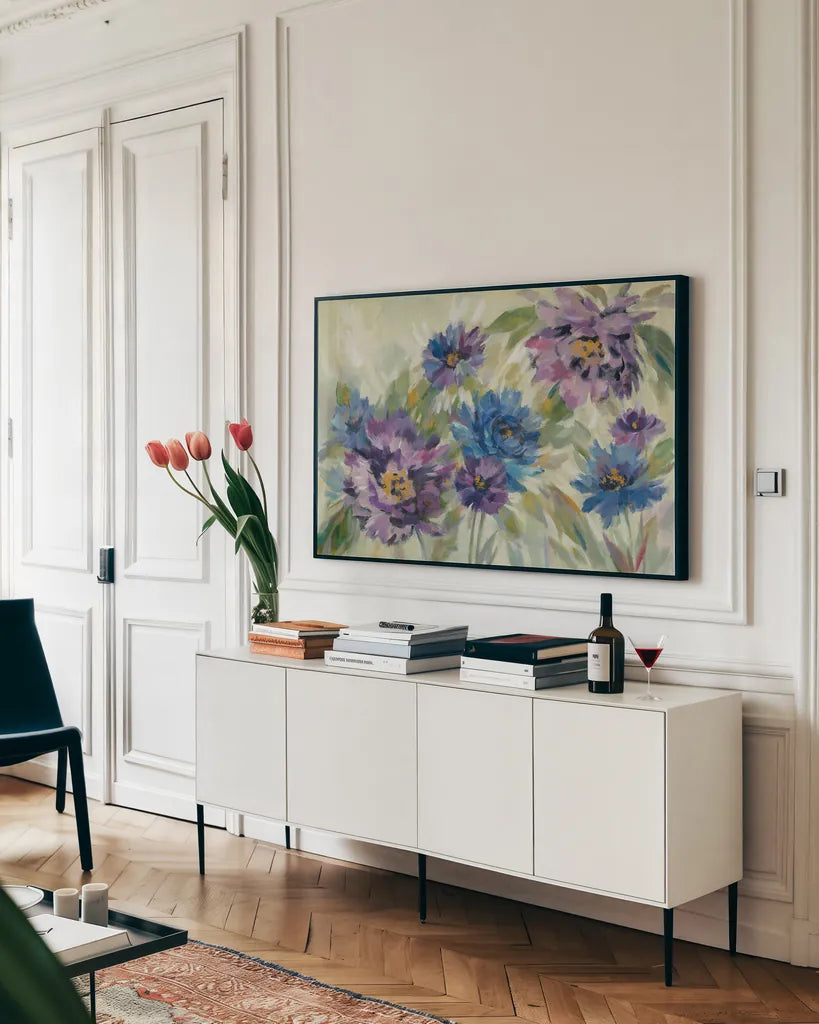 Bold Blue and Lavender Flowers by Silvia Vassileva. shown as a framed stretched canvas in a living room above a console. Available as a archival giclee rolled canvas, fine art paper, or poster print. SKU 55650i.