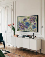 Bold Blue and Lavender Flowers by Silvia Vassileva. shown as a framed stretched canvas in a living room above a console. Available as a archival giclee rolled canvas, fine art paper, or poster print. SKU 55650i.