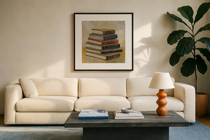 Books on the Porch II Sq by Silvia Vassileva. Displayed in a glass frame with matte in a clean modern living room. Available as an archival giclee rolled canvas, fine art paper, or poster print. SKU 99049a.