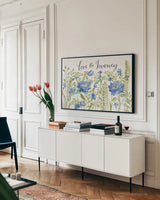Botanical Blue II by Silvia Vassileva. shown as a framed stretched canvas in a living room above a console. Available as a archival giclee rolled canvas, fine art paper, or poster print. SKU 61780i.