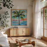 California Palm II by Silvia Vassileva. Shown in a natural wood frame in a cozy modern living room. Available as an archival giclee rolled canvas, fine art paper, or poster print. SKU 22487a.