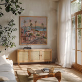 California Sunrise Street by Silvia Vassileva. Shown in a natural wood frame in a cozy modern living room. Available as an archival giclee rolled canvas, fine art paper, or poster print. SKU 95132a.
